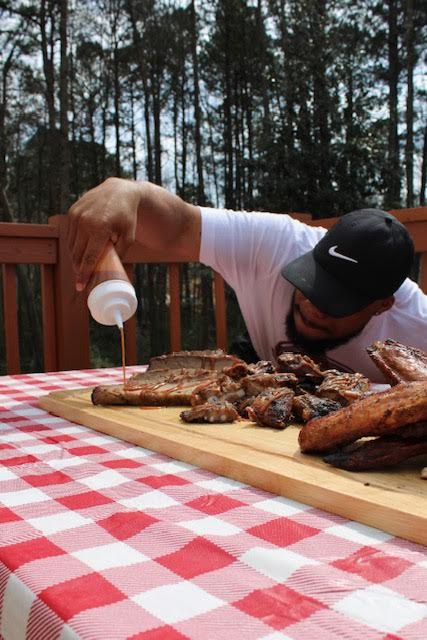 Chef Cheez preparing barbecue outdoors